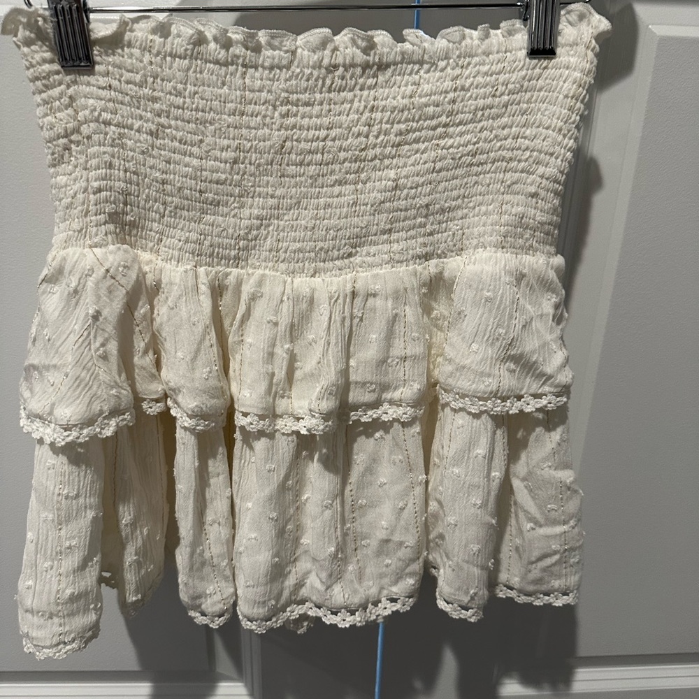 Cream skater skirt with gold threading and detail.